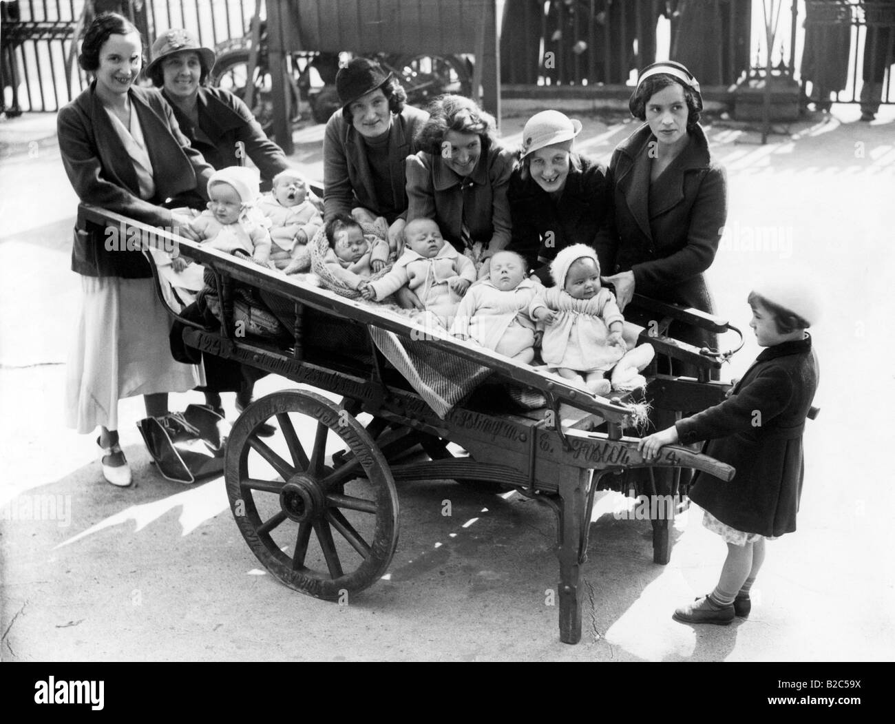A cartload of babies, historical photo, circa 1920 Stock Photo