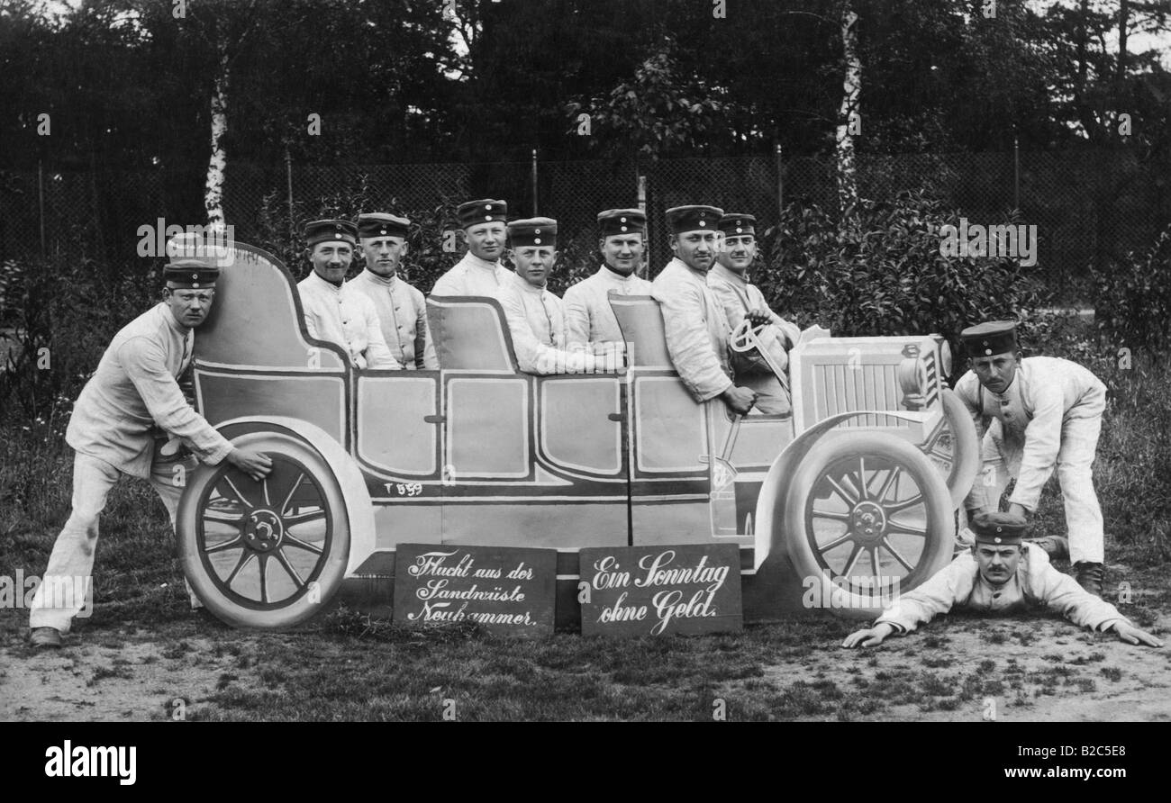 Uniformed men sitting in a fake car, historic picture from about 1910 Stock Photo
