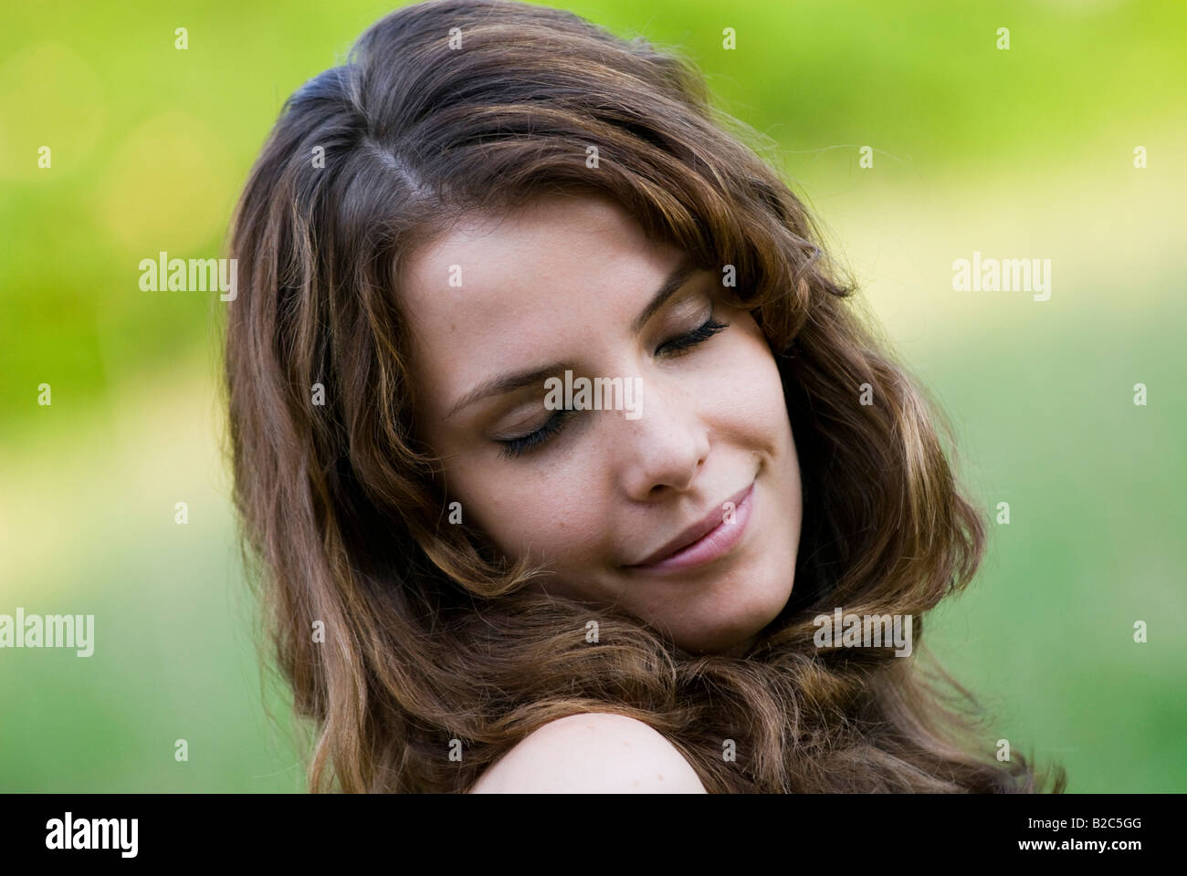 smiling young woman with closed eyes Stock Photo - Alamy