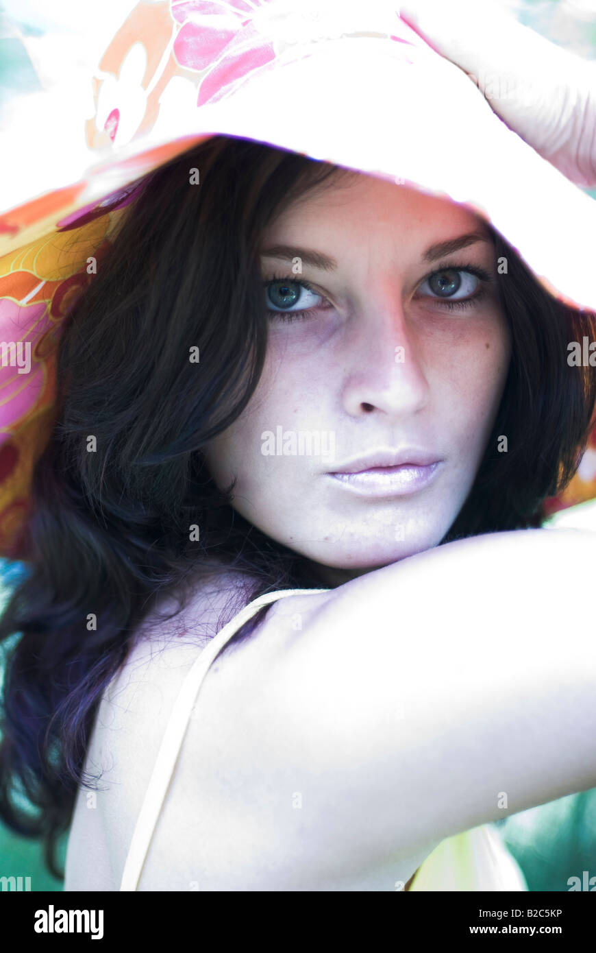 cute dark-haired woman with a multicoloured hat Stock Photo