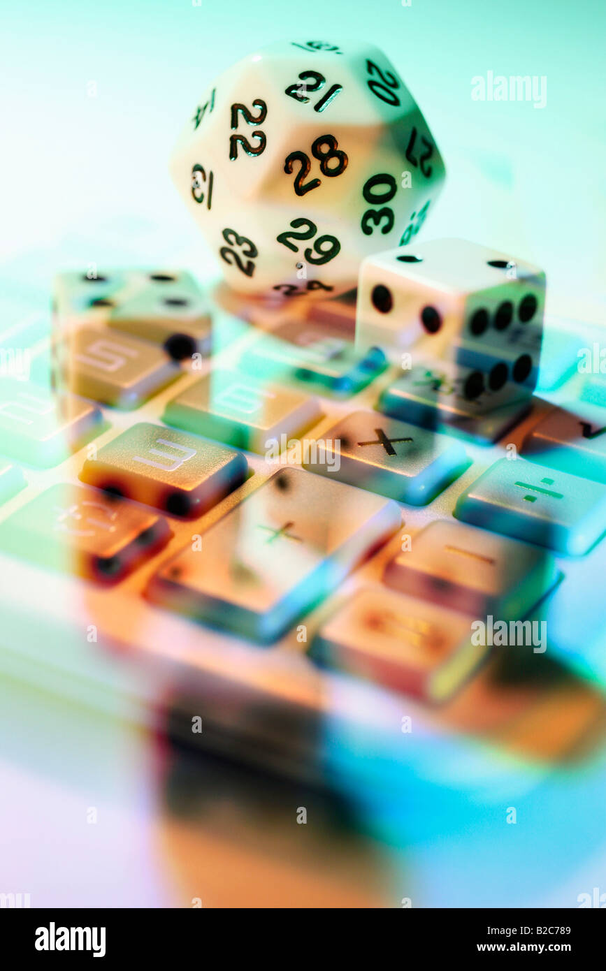 Composite of dice and calculator Stock Photo