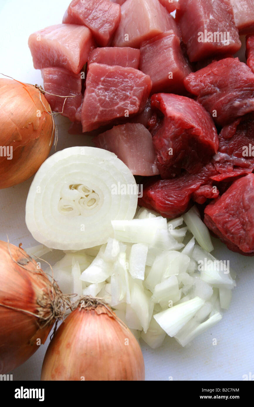 Raw beef goulash and onions, goulash preparation Stock Photo