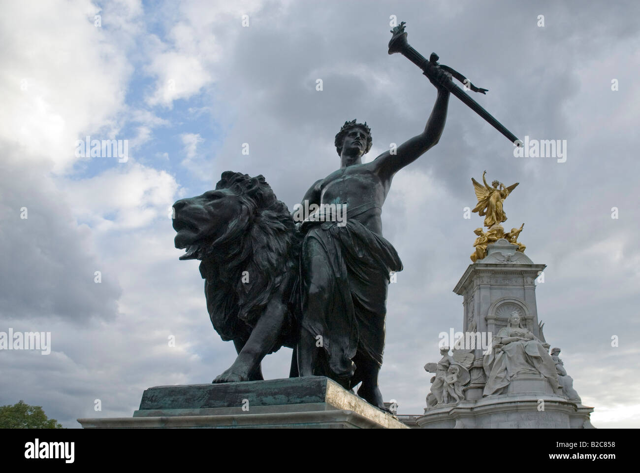 Bronze statue of a man and a lion, Queen Victoria Monument, in front of