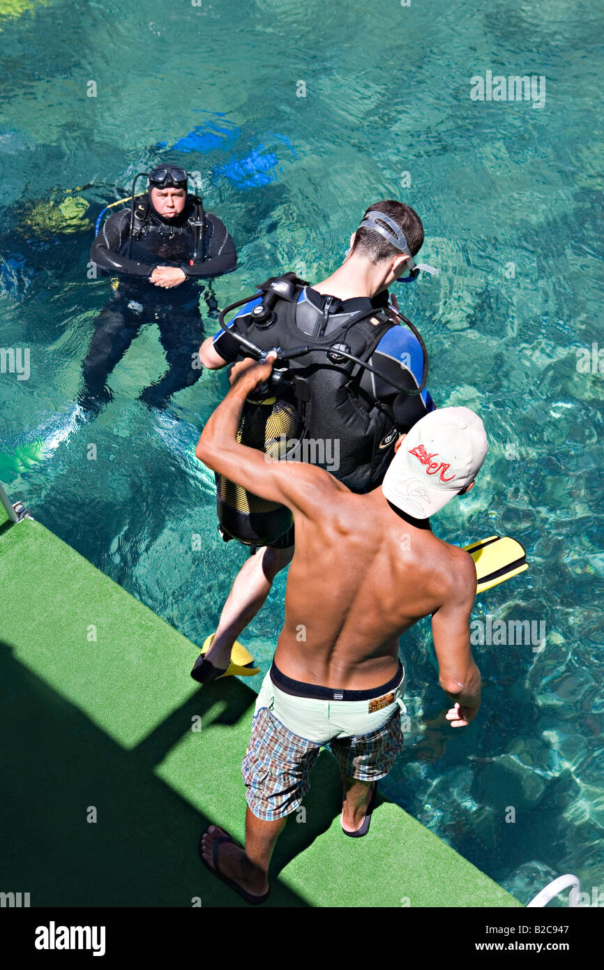 Diver jumping with Scuba diving equipment into water Icmeler Marmaris Mugla Turkey Stock Photo