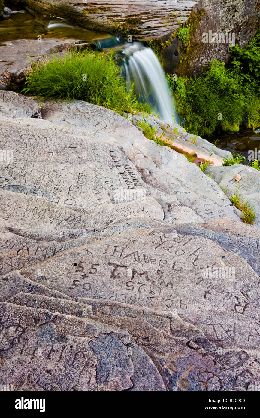 Old graffiti on rocks atop Kaaterskill Falls Stock Photo