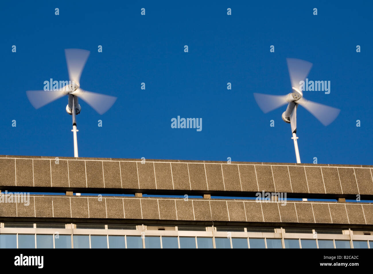 Wind Turbines on the roof of a building in South London England Britain UK Stock Photo