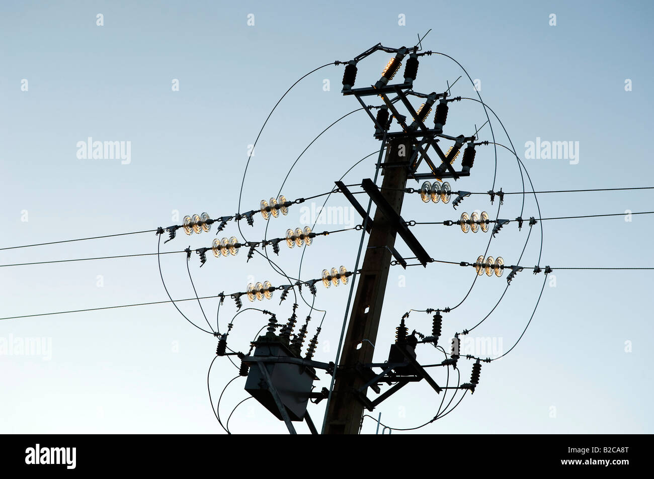 Electricity pole and wiring against the blue sky Stock Photo - Alamy