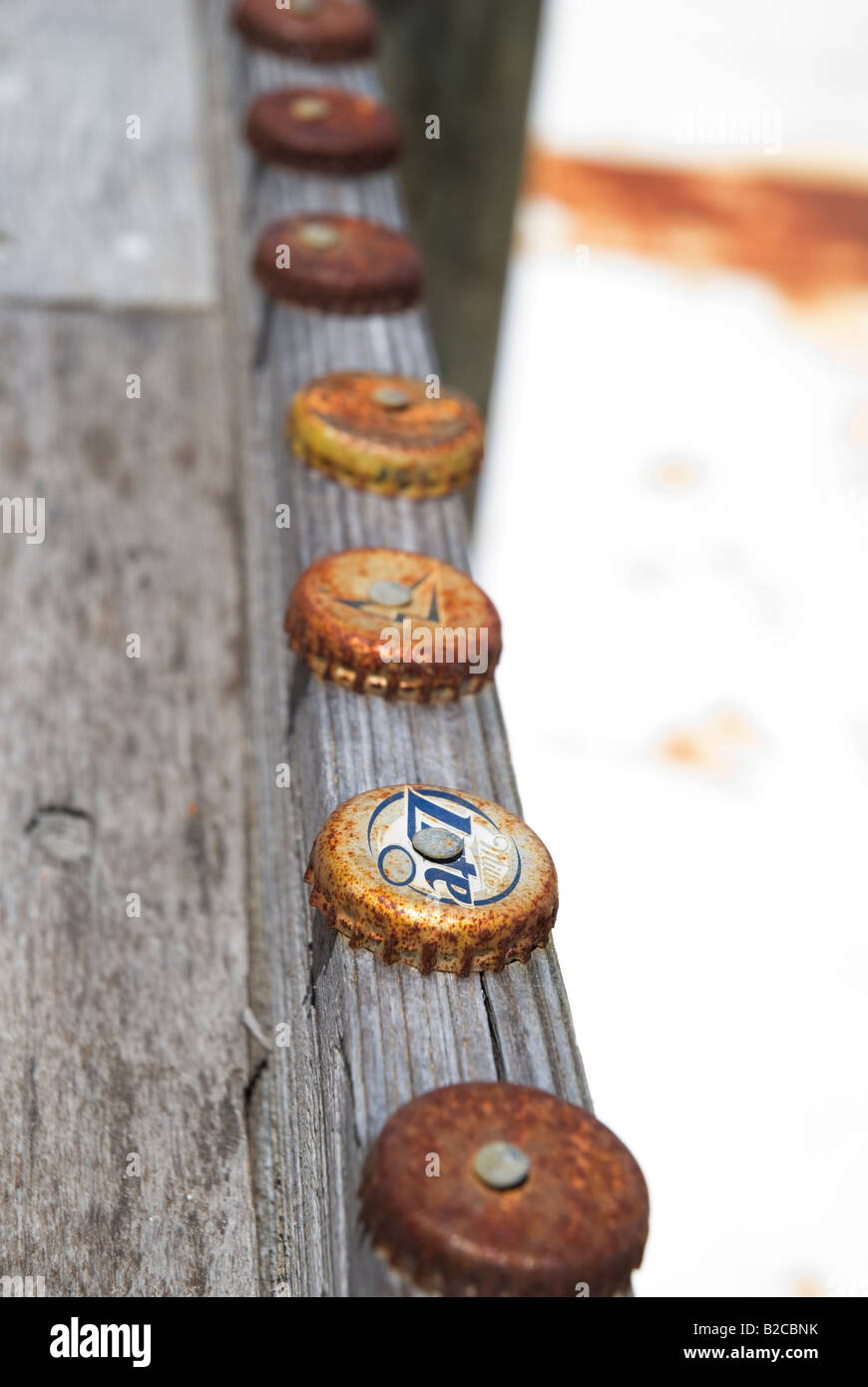 beer caps decorating a railing Apalachicola Florida Stock Photo - Alamy
