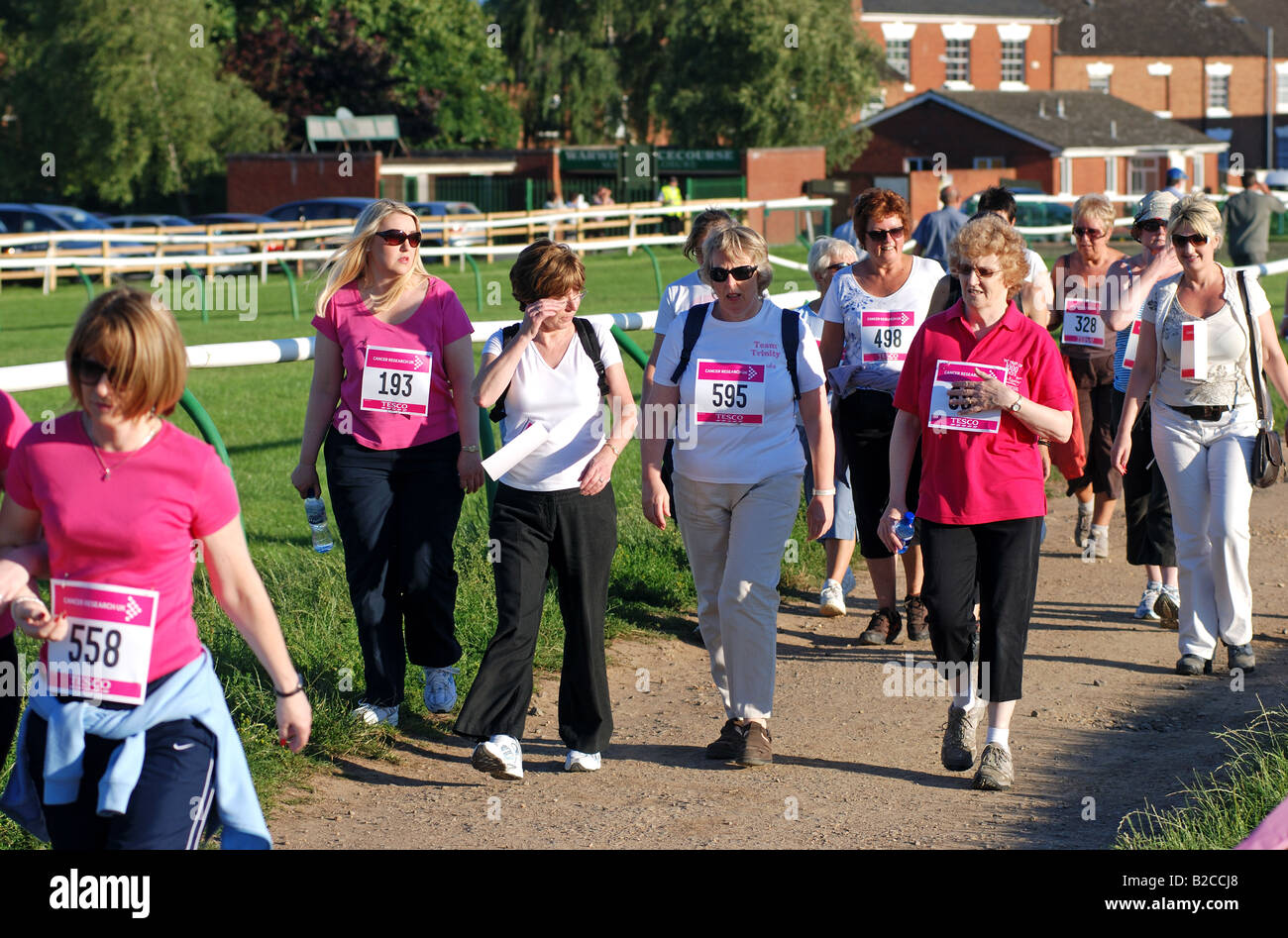 Women walking in Race for Life cancer charity event at Warwick ...