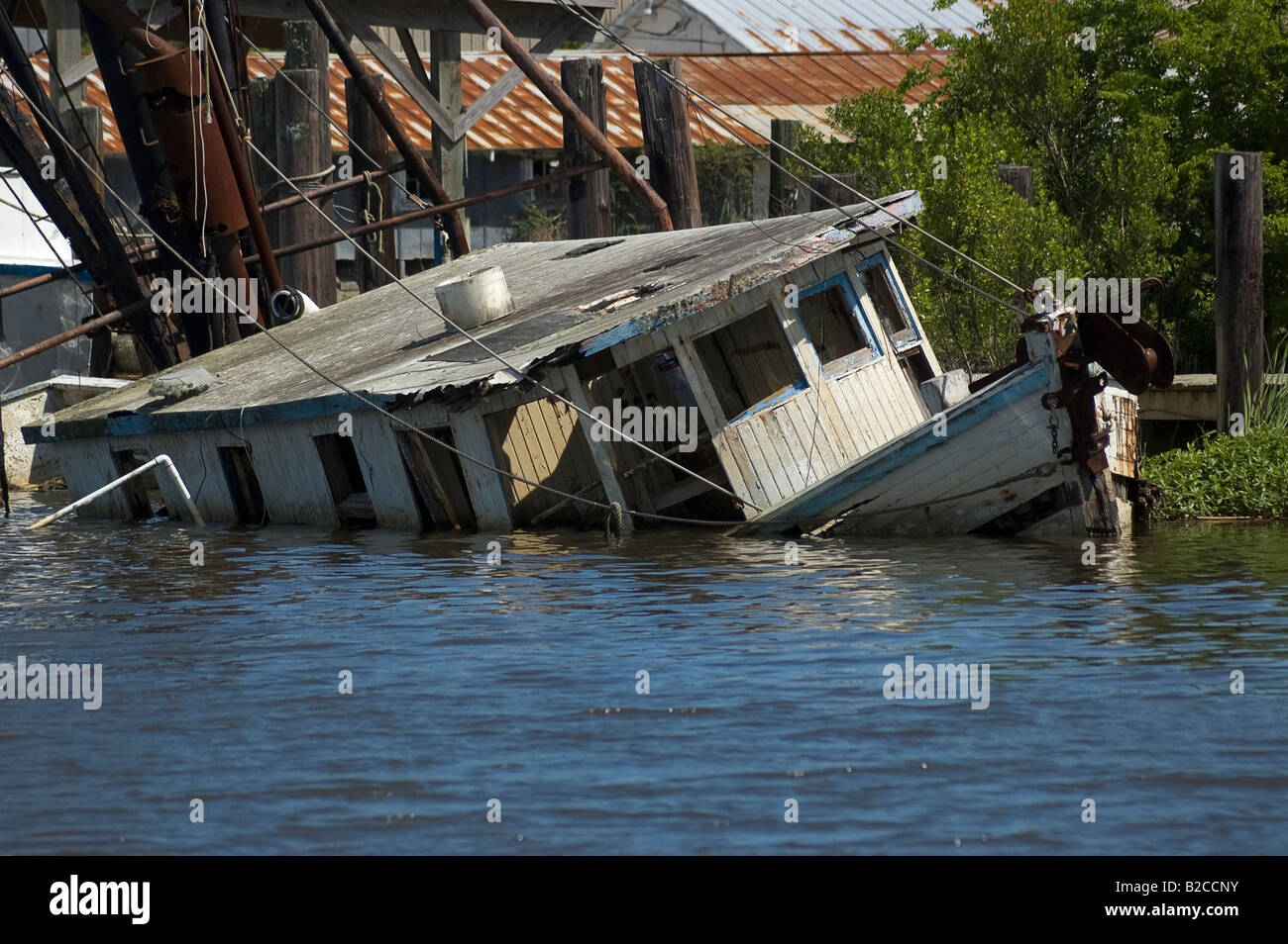 sunken boat along waterfront of Apalachicola Florida Stock Photo