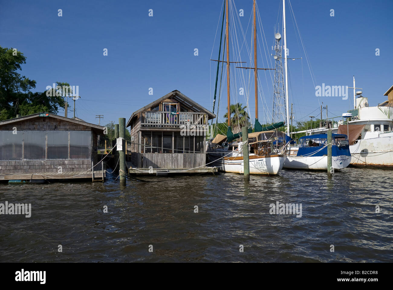 houseboats and sailboats moored along Scipio Creek Apalachicola Florida