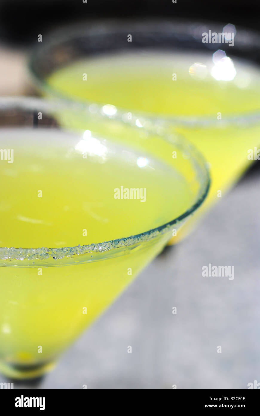 Two martini glasses filled with a Lemon Drop cocktail Stock Photo