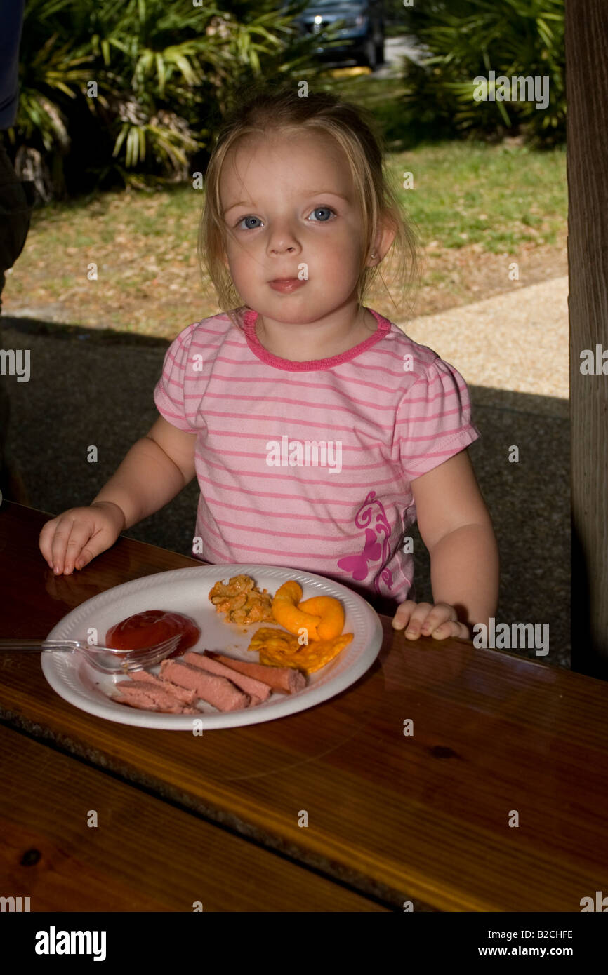 Young Girl Eating a Picnic Meal Stock Photo Alamy