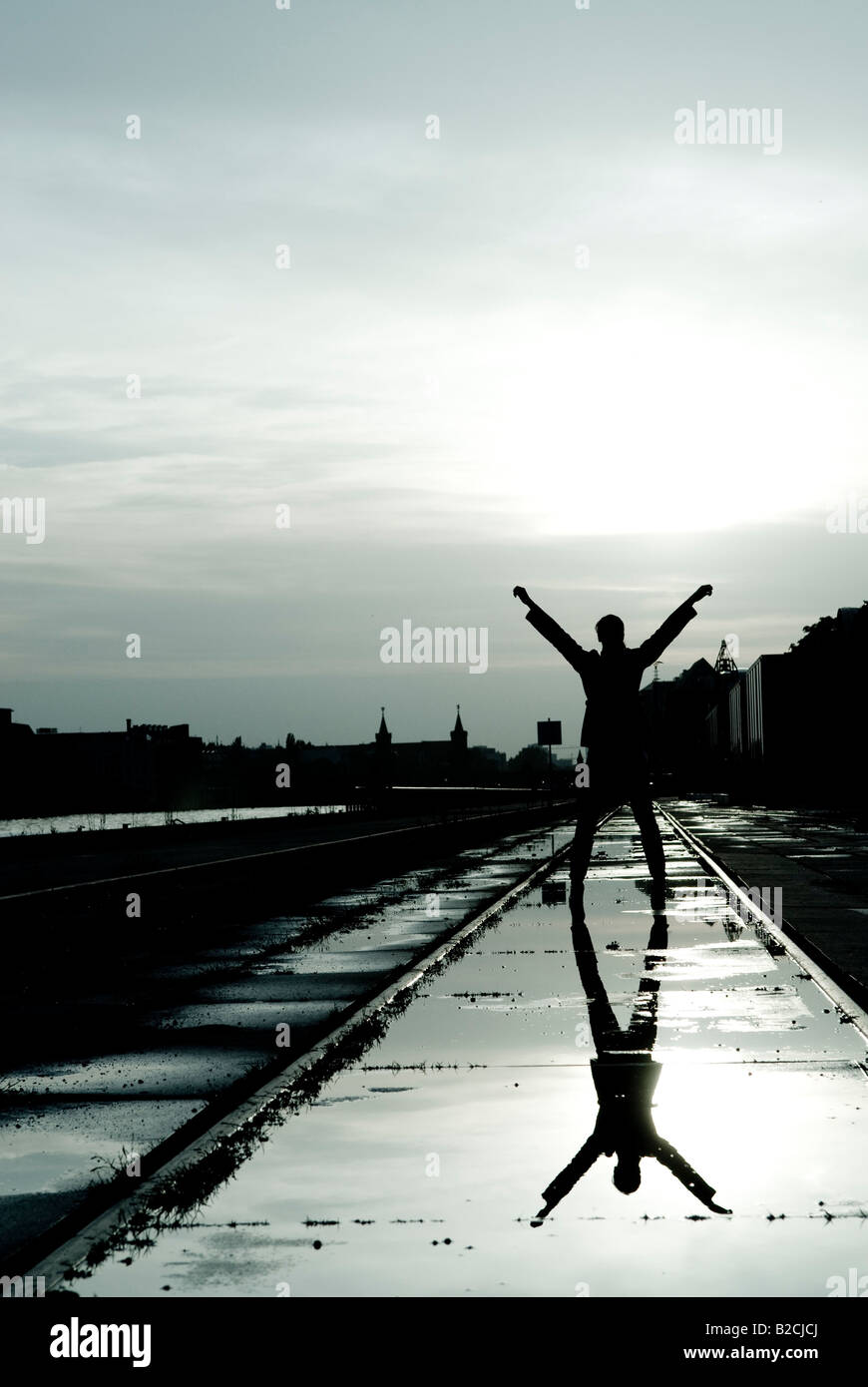 Woman silhouette arms up hi-res stock photography and images - Alamy