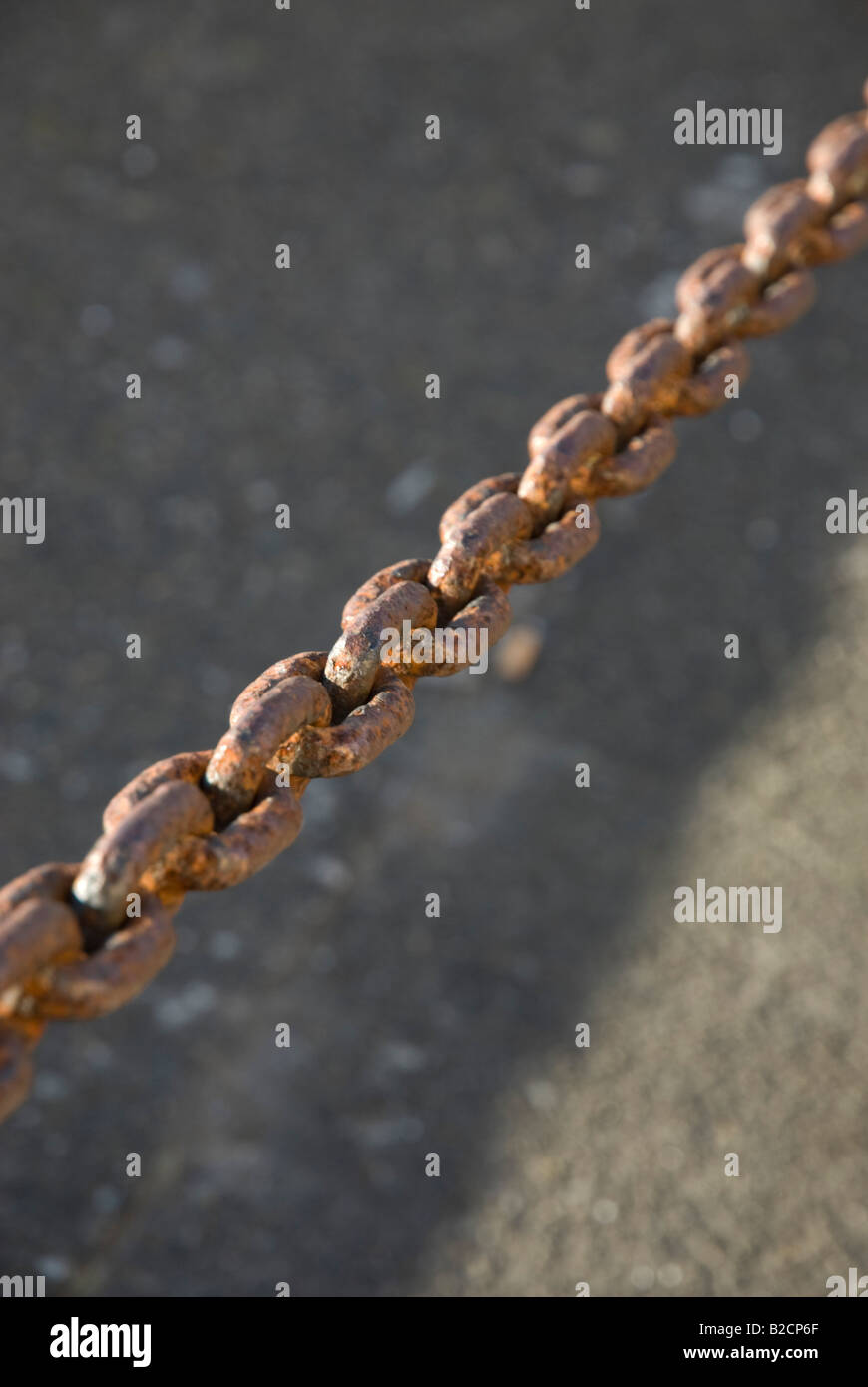 Rusty chain in evening sunlight Stock Photo - Alamy