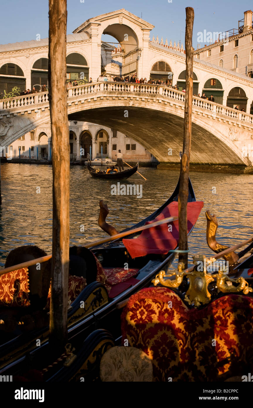 View across gondolas towards Rialto Bridge in Venice in Italy Stock Photo