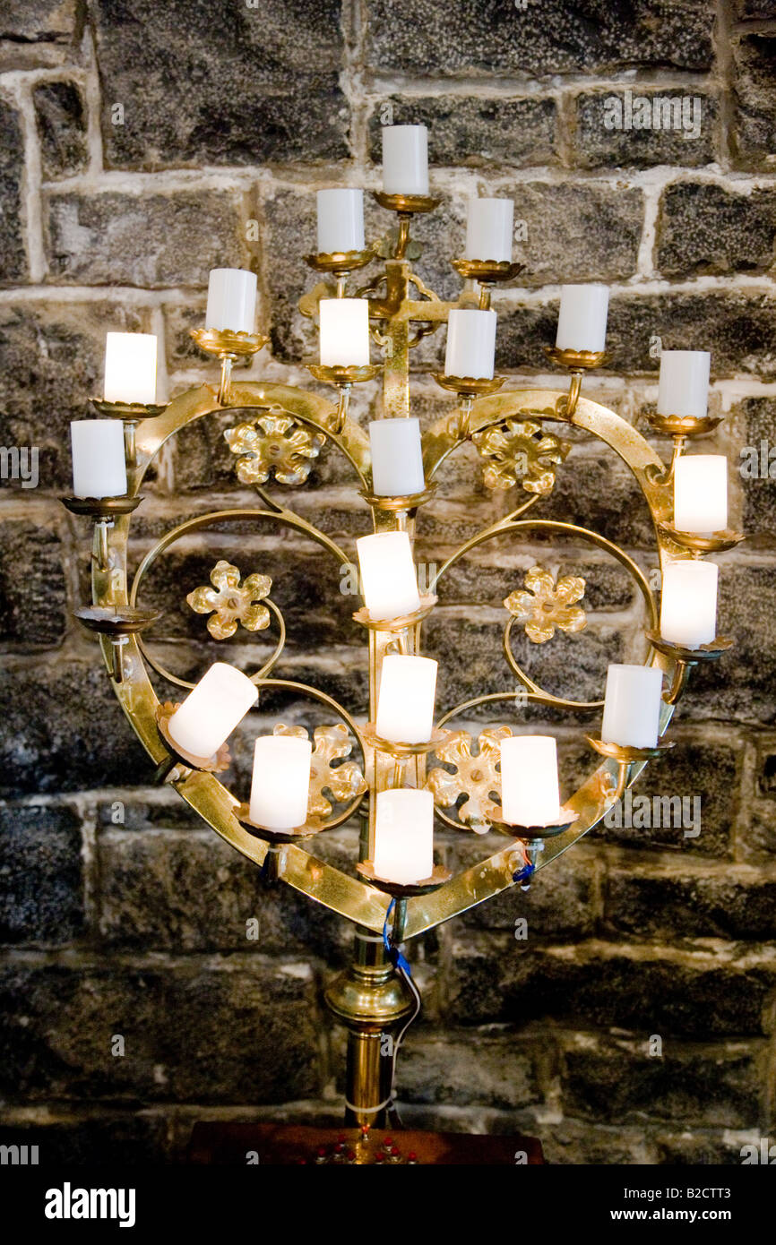 Candles in the shape of a heart. Irish Catholic church, Adare, County