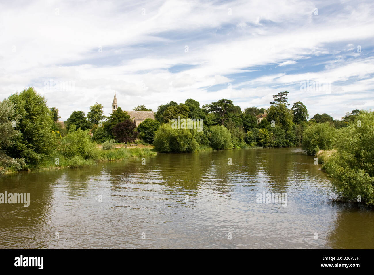 River Thames or Isis at Clifton Hampden Oxfordshire with a view of the Church of St Michaels and All Angels Stock Photo