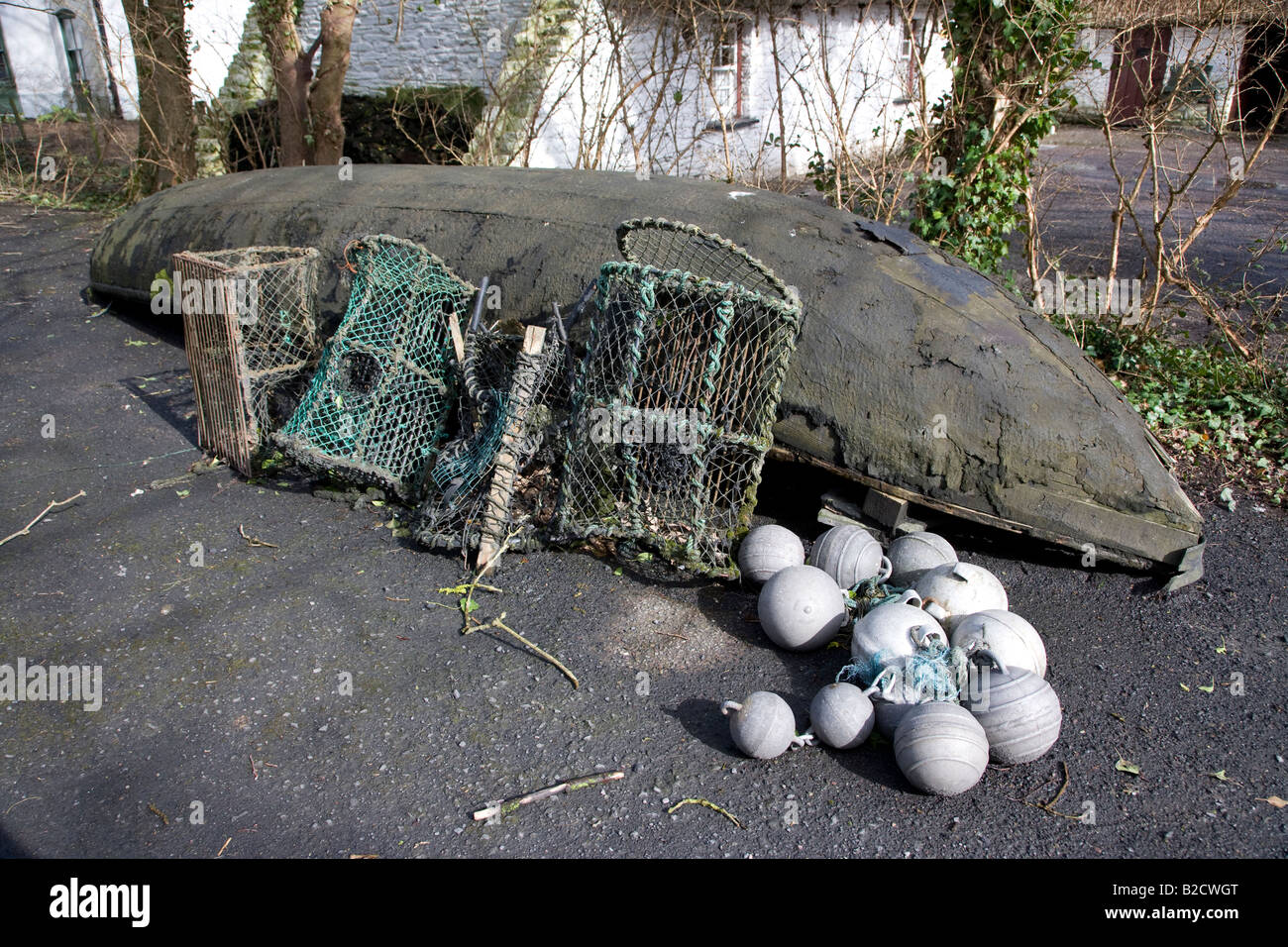 Old Irish fisherman's boat with nets and buoys, Bunratty Folk Park, County Clare, Ireland Stock Photo