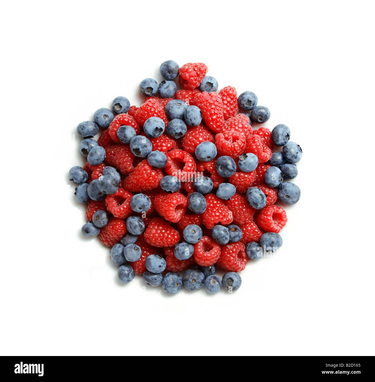 Delicious blueberries and red raspberries isolated on white background