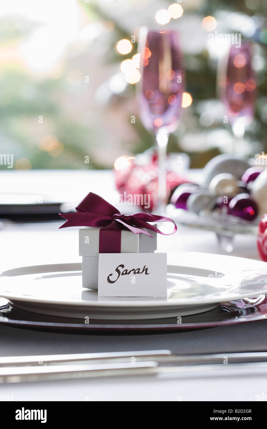 Small gift box with name tag on dining table Stock Photo Alamy