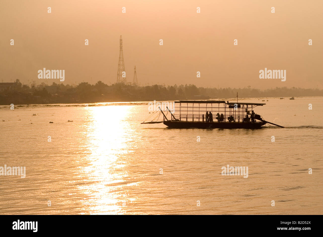 A ferry floats on one of the waterways of the Mekong Delta of Vietnam ...