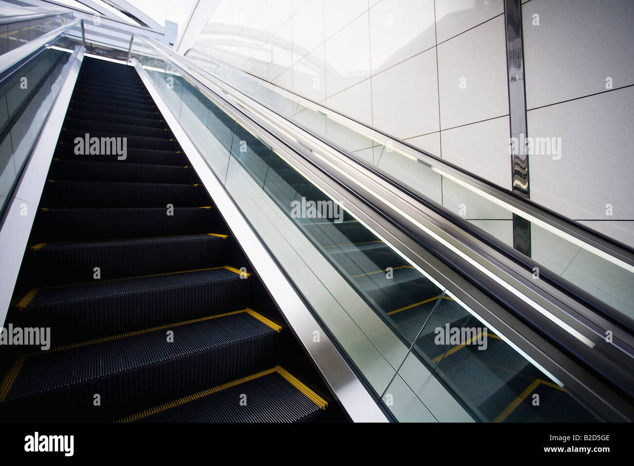 Japan, Osaka, JR Station, man on top of escalator Stock Photo