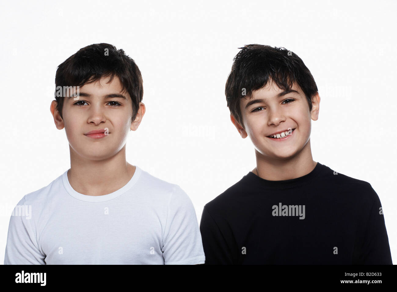 Studio portrait of twin boys (13-15) Stock Photo