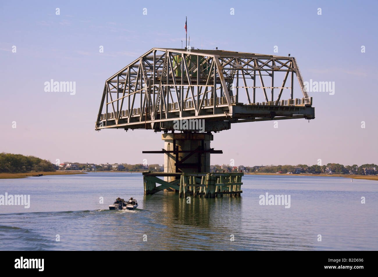 Boats pass under the Sullivan s Island South Carolina swing bridge along the Intercoastal