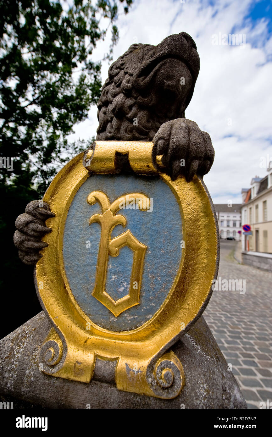 A statue of a lion on the lion bridge or Leeuwenbrug in Bruges holds a shield Stock Photo