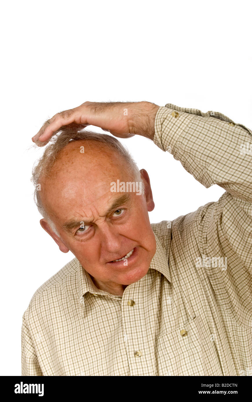 Vertical close up portrait of an elderly gentleman supporting a lengthy comb over hairstyle Stock Photo