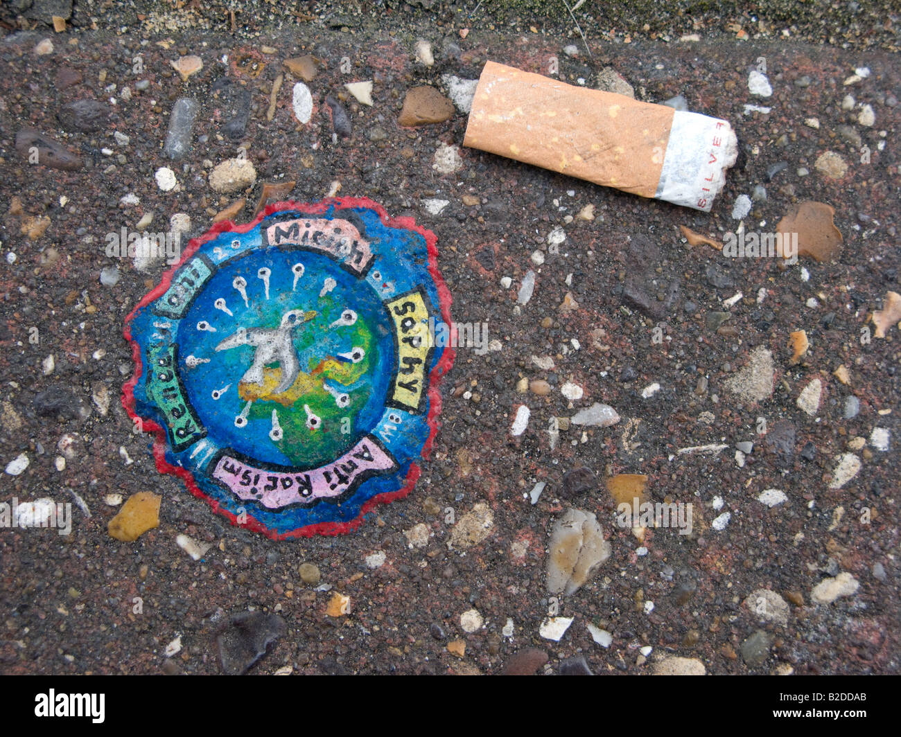 Street Art A Painting on Discarded Chewing Gum on a City Street Stock