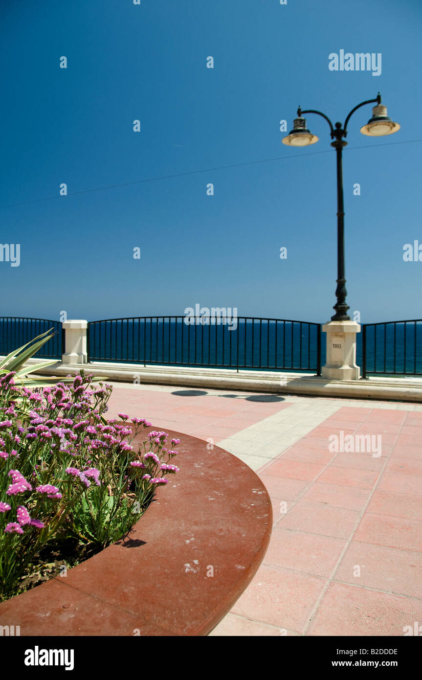 mediterranean seaside garden and pedestrian boulevard walkway with classic architecture lampost sliema malta europe Stock Photo