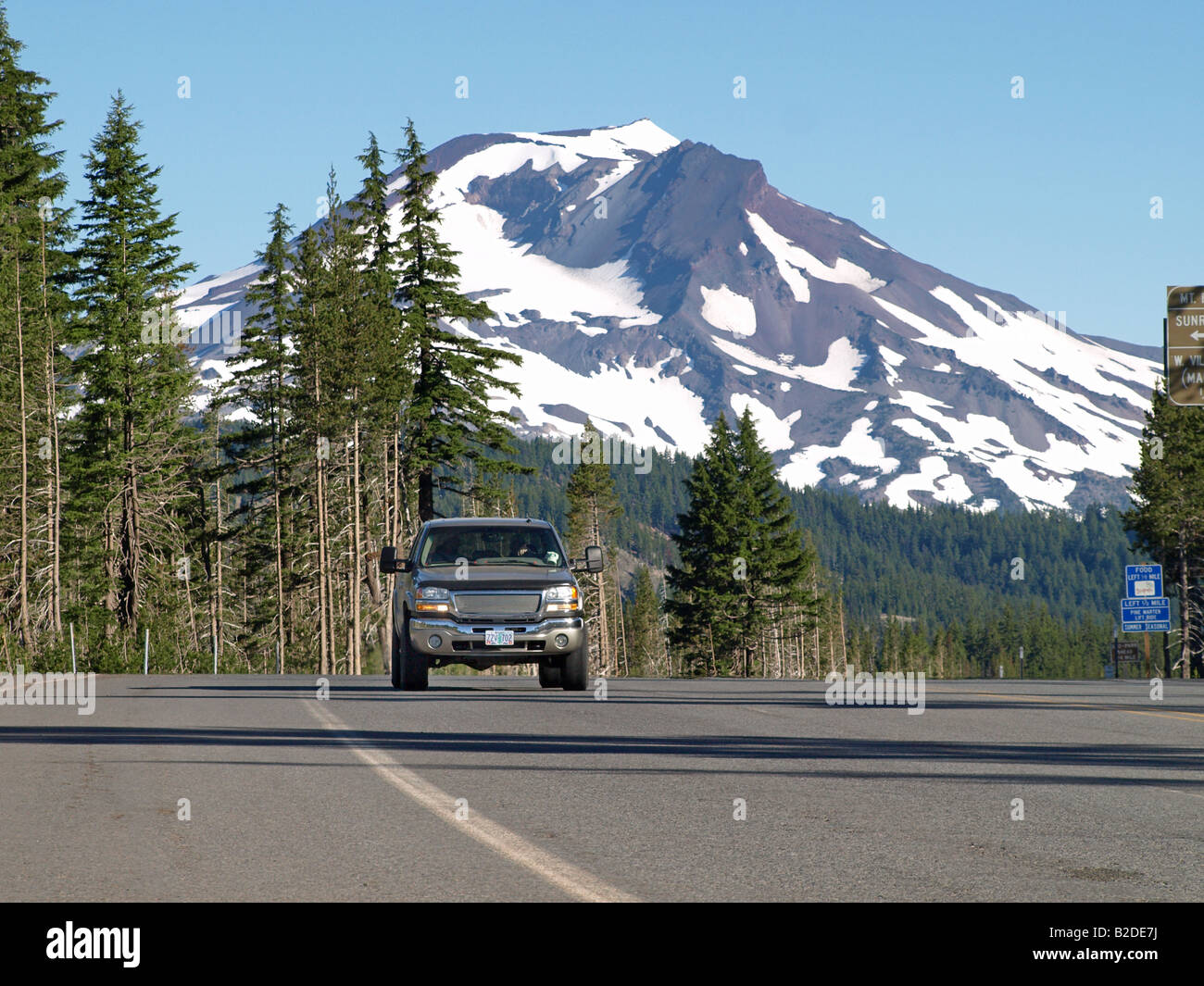 A car navigates the in the central Oregon Cascades near Mount Bachelor