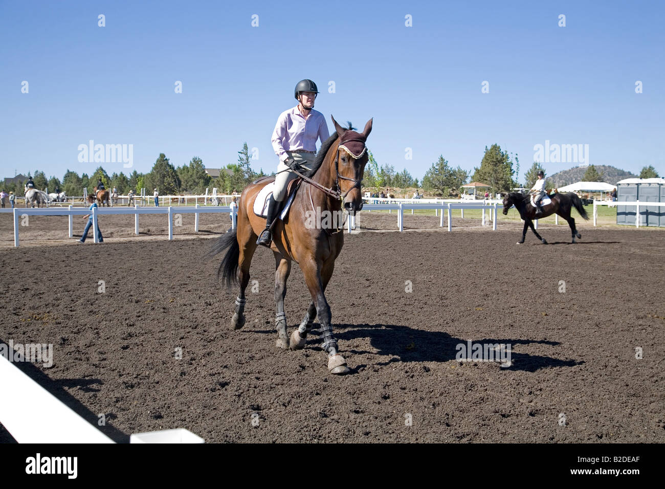 A rider in the practice ring at the High Desert Classic equestrian horse and riding show during July Stock Photo