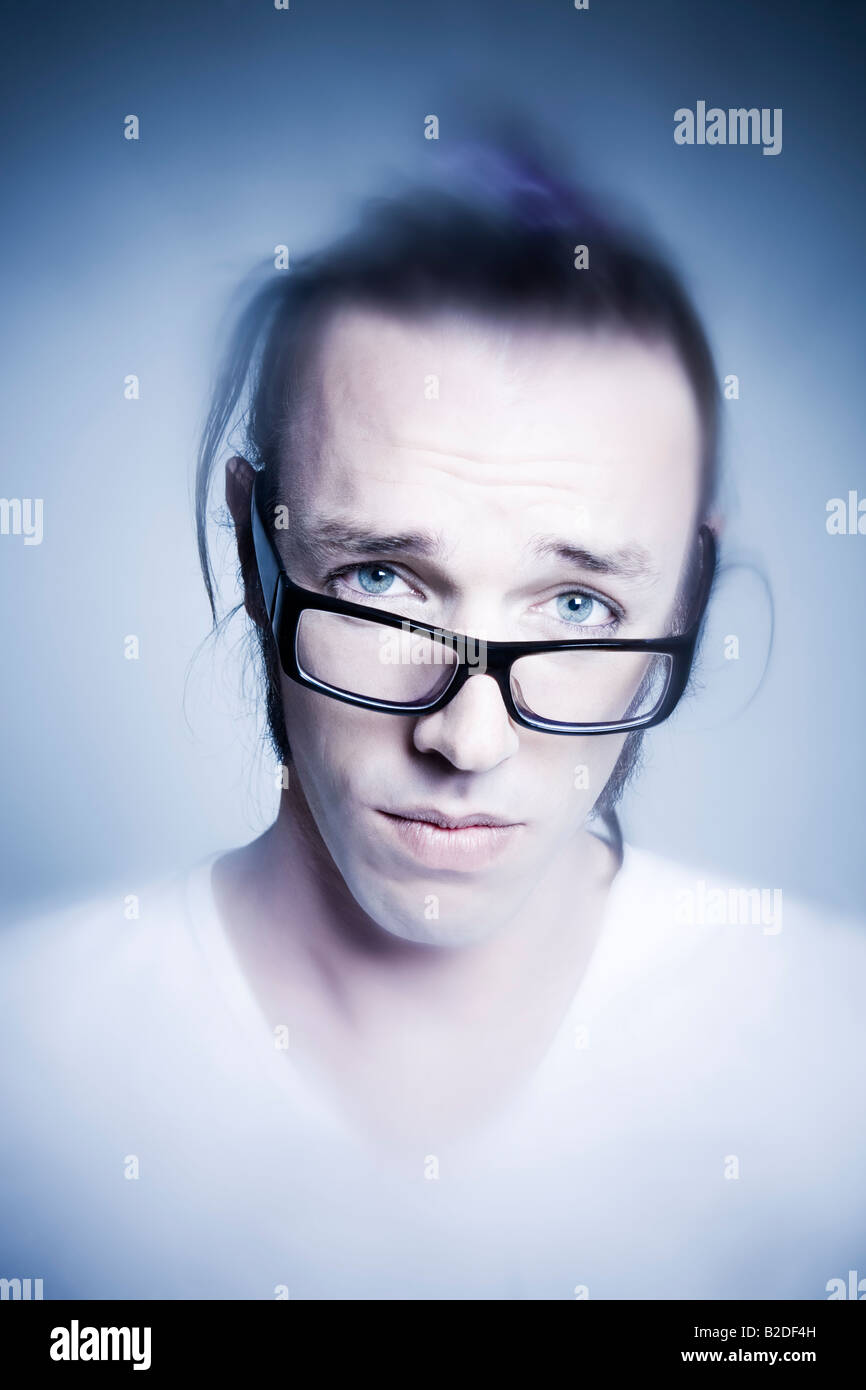 studio shot portrait of young expressive man making faces Stock Photo ...