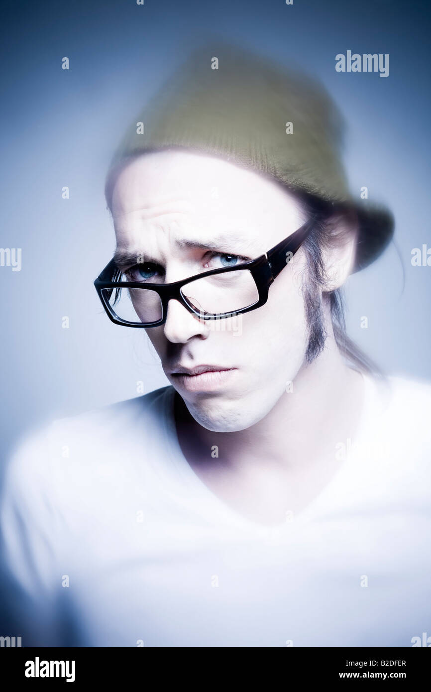 studio shot portrait of young expressive man making faces Stock Photo ...