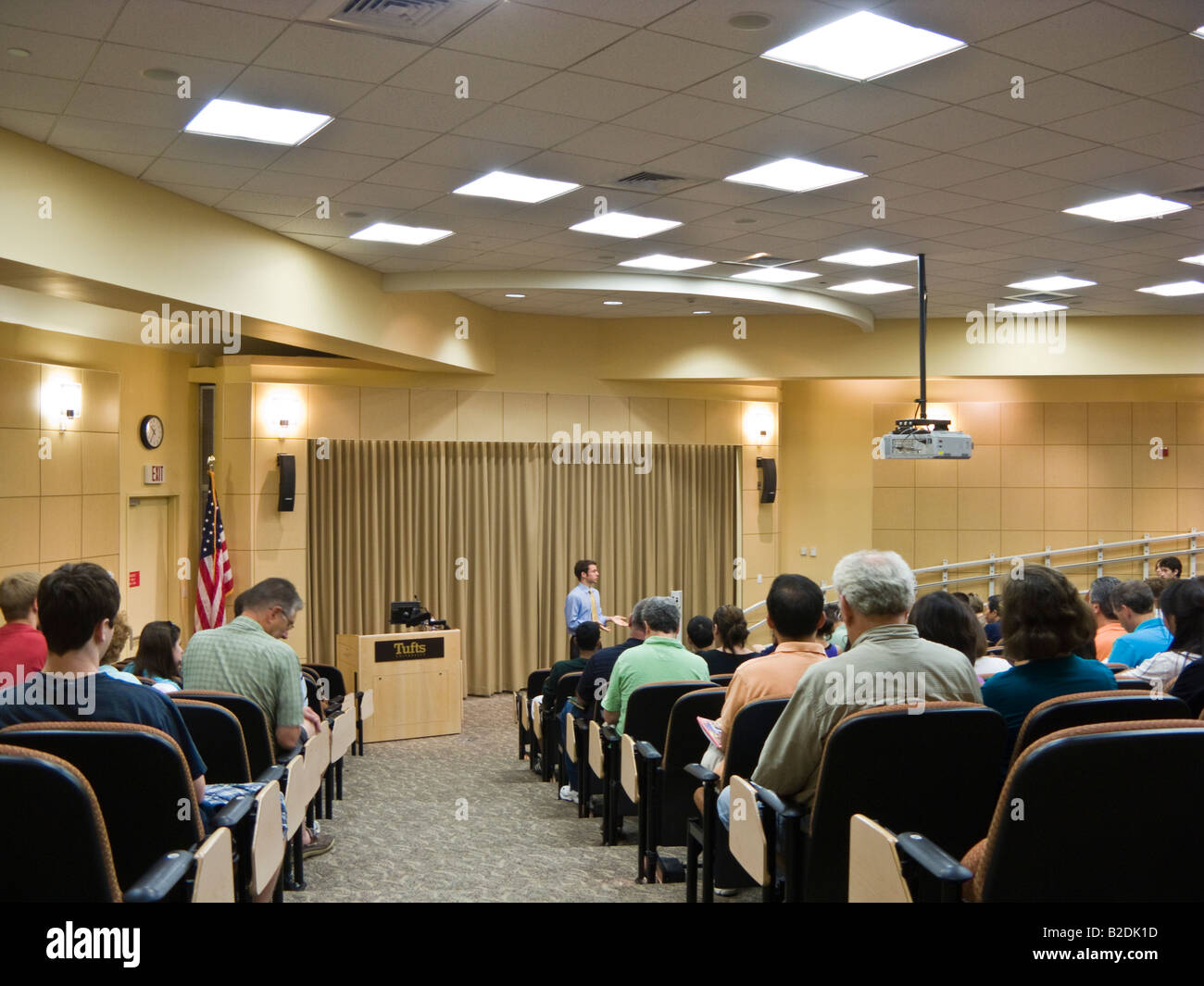 parents and prospective students listening to admissions information session given by former faculty member at Tufts University Stock Photo