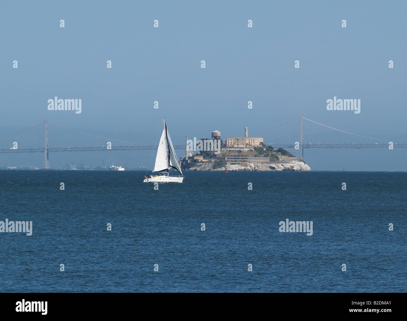 Sail boat sailing near Alcatraz Island in San Francisco Bay, California Stock Photo