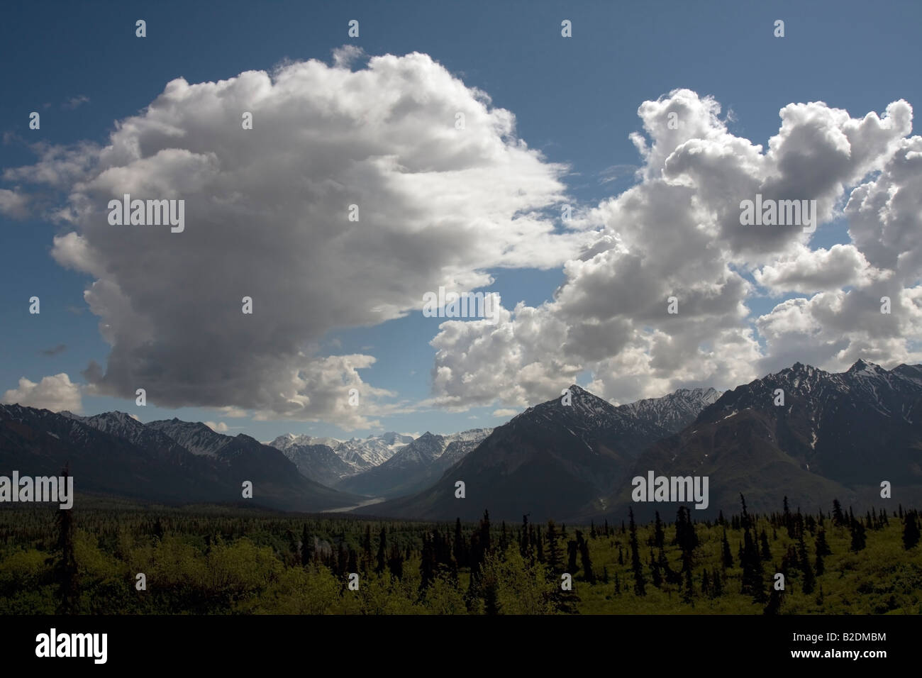 Big clouds forming over mountain range Stock Photo - Alamy