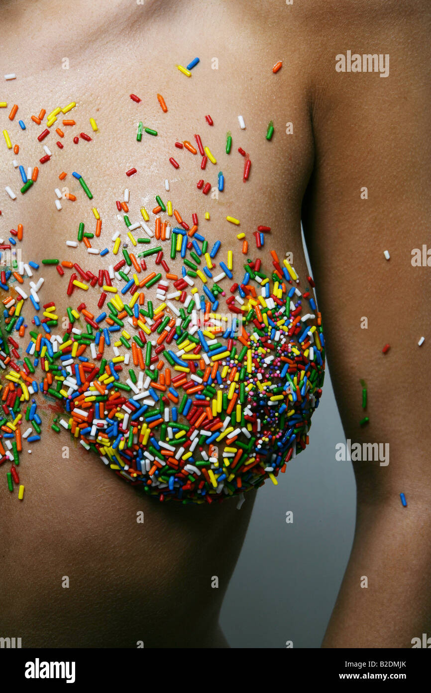 Detail of woman's breast covered with sprinkles Stock Photo - Alamy