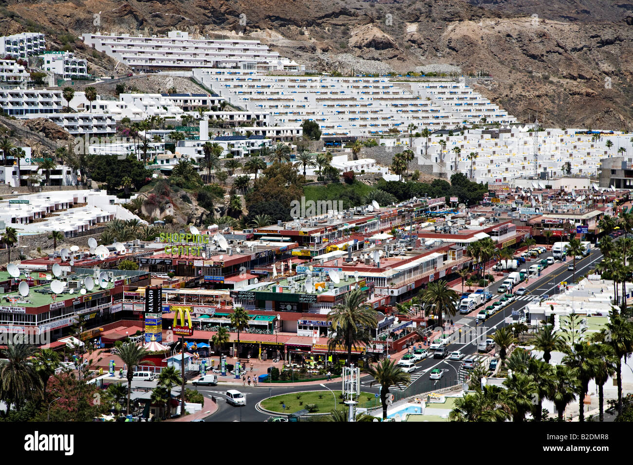 Modern holiday resort of Puerto Rico with shopping centre surrounded by  concrete built accommodation Gran Canaria Spain Stock Photo - Alamy