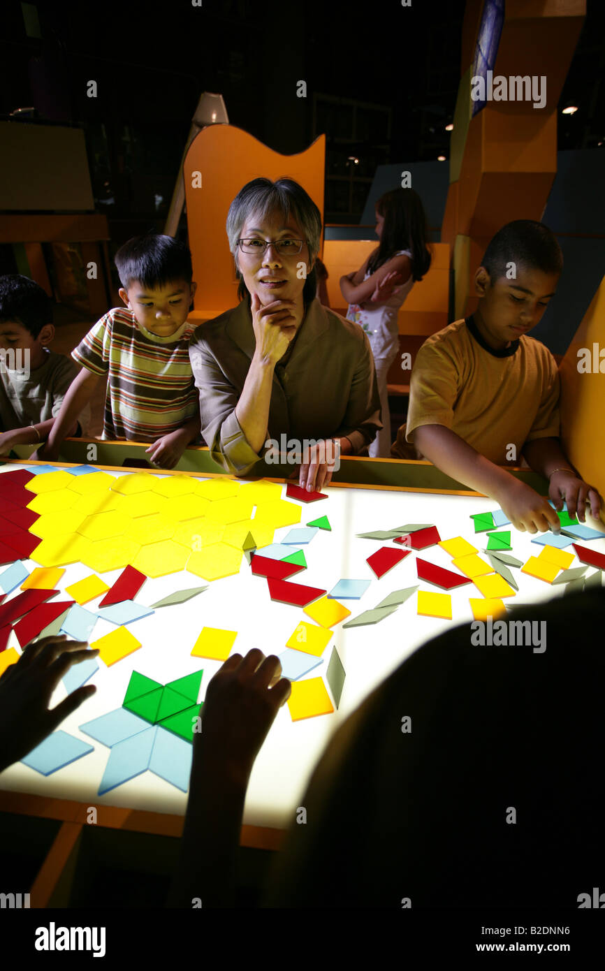 Students and art teacher in art class Stock Photo - Alamy