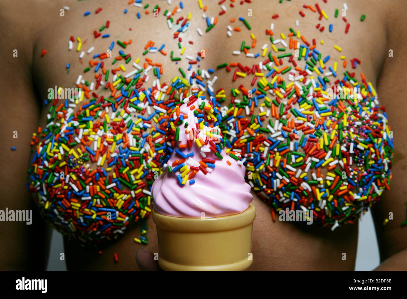 https://c8.alamy.com/comp/B2DP6E/womans-sprinkled-breasts-with-ice-cream-cone-B2DP6E.jpg