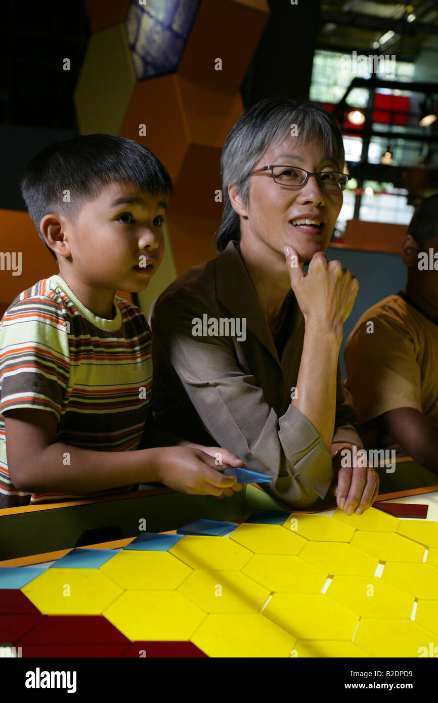 Students and art teacher in art class Stock Photo - Alamy