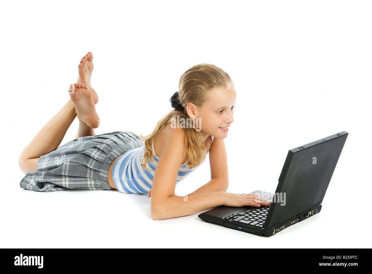 Teen girl with laptop isolated on white Stock Photo - Alamy