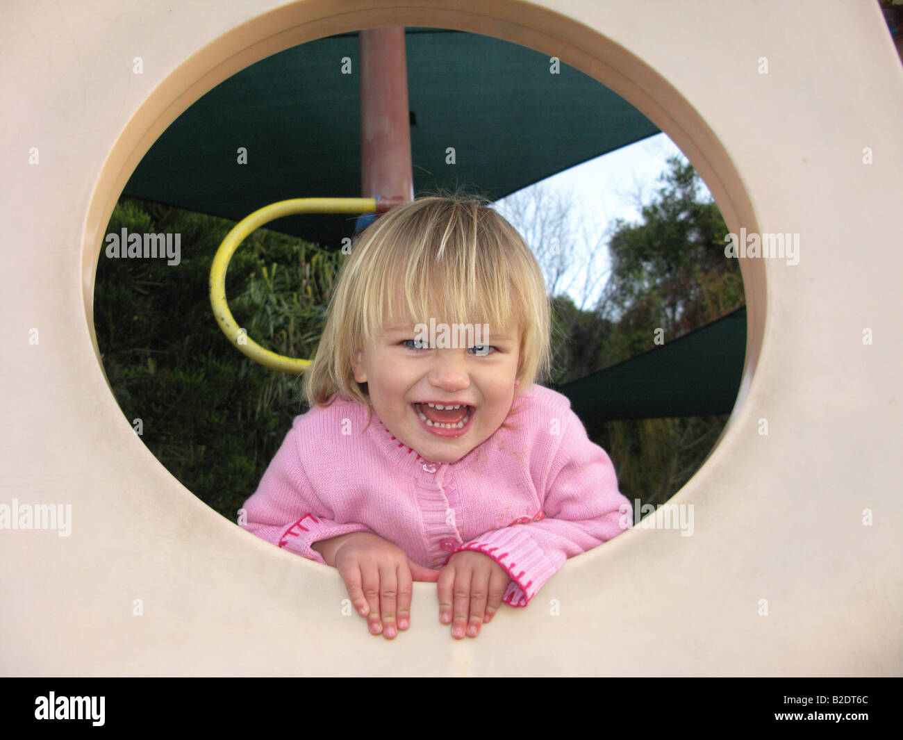 Portrait of a child girl playing in a playground Stock Photo - Alamy