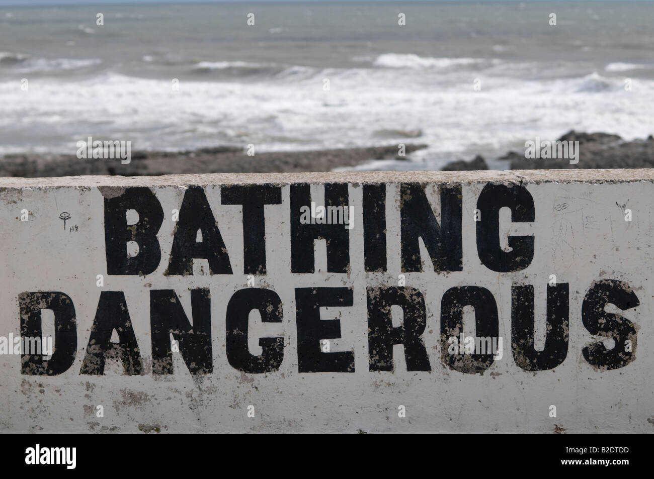 Bathing Dangerous sign  - no swimming in the sea at Porthcawl South Wales Stock Photo