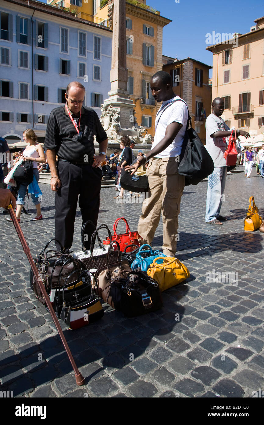 Selling Fake Bags On The Street Rome Italy Stock Photo - Download