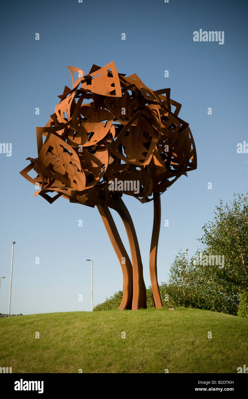 Sculpture of an oak tree the symbol of Carmarthen made from rusty iron or steel plate Carmarthen Wales UK Stock Photo